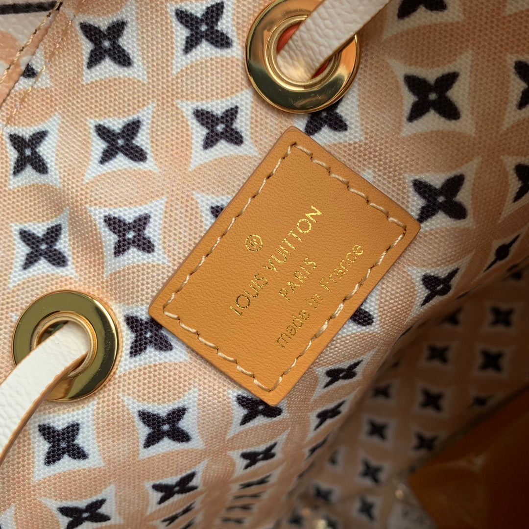 Louis Vuitton White Leather Drawstring Bucket Bag with Pastel Geometric Print