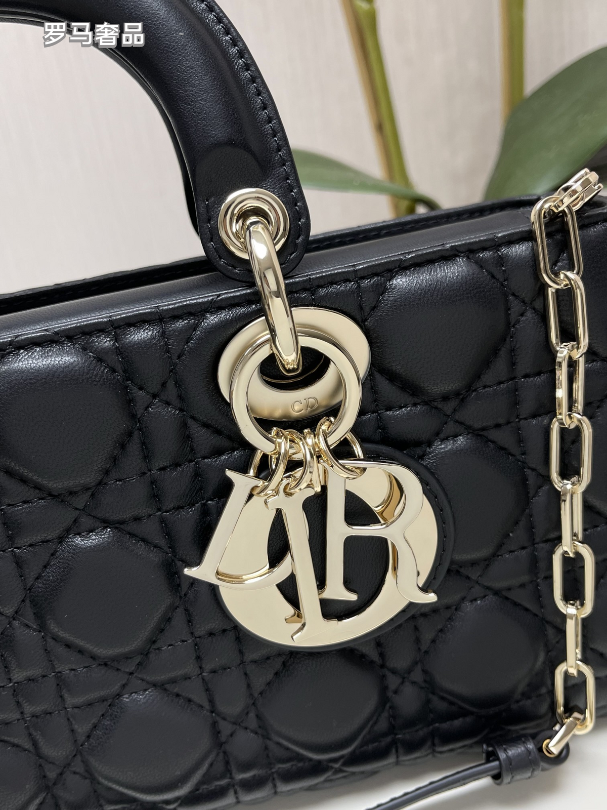 Dior Black Quilted Leather Handbag with Top Handle and Gold Chain Strap